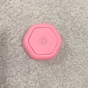 Cadence Capsule SMALL travel container in bright pink
